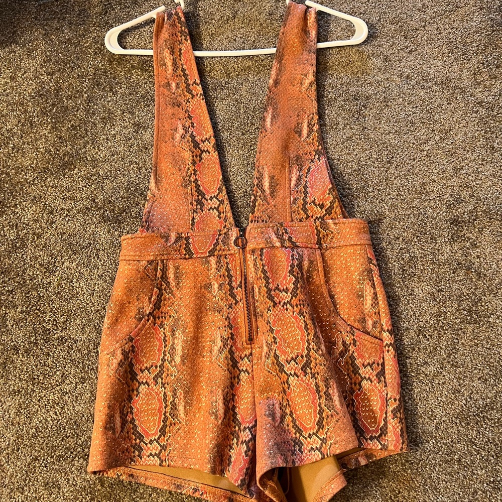 Size small romper. Brand new.